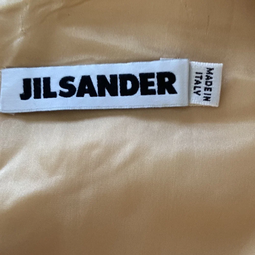 Jil Sander Designer midi dress in a eggshell cream color, fitted cockta…